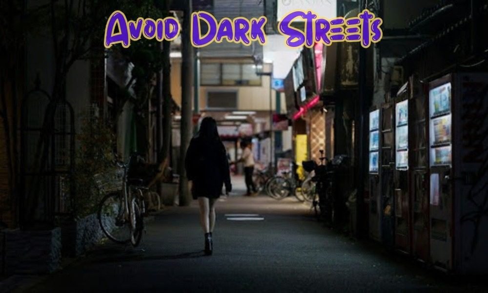 A woman walking alone down a dark, narrow city alley at night, essential for learning Solo Female Travel Safety Tips for trips.