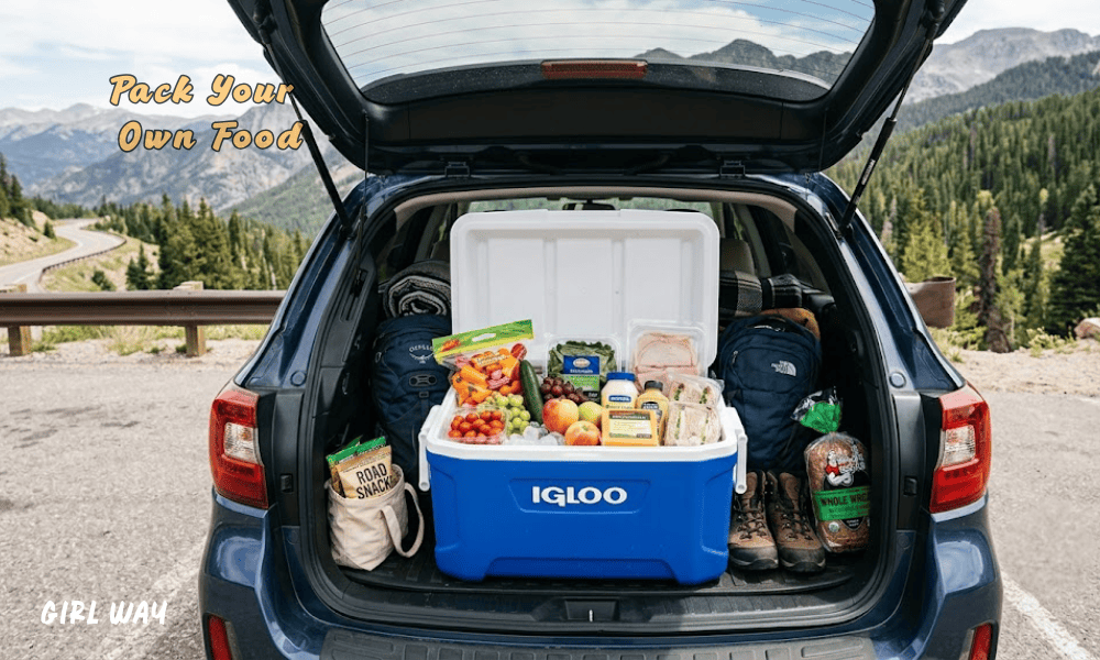 Discover How to Road Trip on a Budget by packing a blue cooler full of fresh food and snacks inside the trunk of your SUV.      