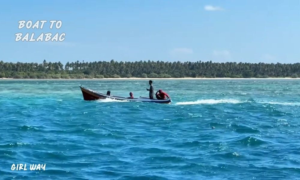 A small passenger boat on turquoise water during my journey. Figuring out How to Get to Balabac, Palawan is a true adventure.