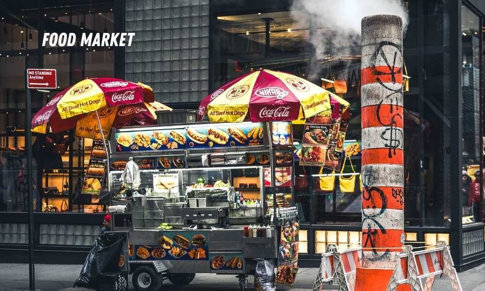 Discover Budget Travel Tips for Expensive USA Cities by finding affordable street food at busy urban food market vendor carts.