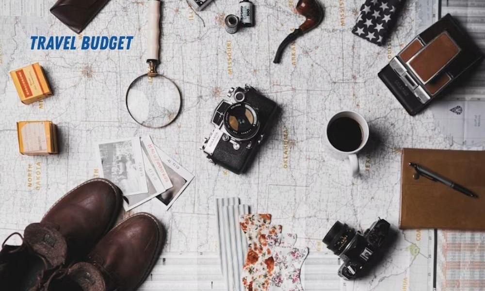 Discover smart Budget Travel Tips for Expensive USA Cities using a map, vintage cameras, coffee, and boots for your next trip.